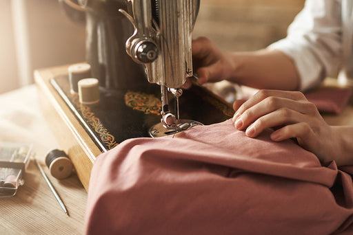 an alteration being made on an old fashioned sewing machine