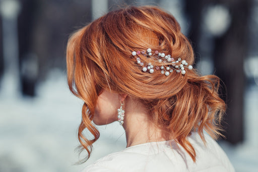 beautiful red hair styled with a decorative hair slide