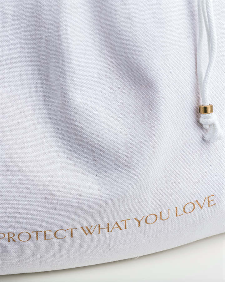 a close up of the writing on a dust bag which says 'protect what you love'