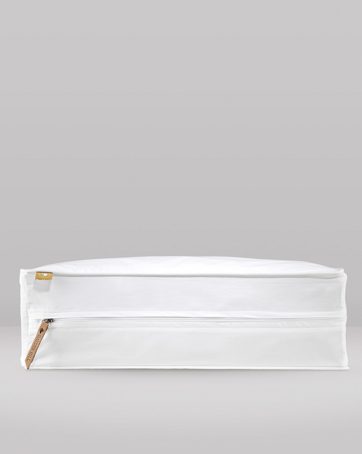 a side profile of an extra large storage bag showing the leather zipper pull and pip