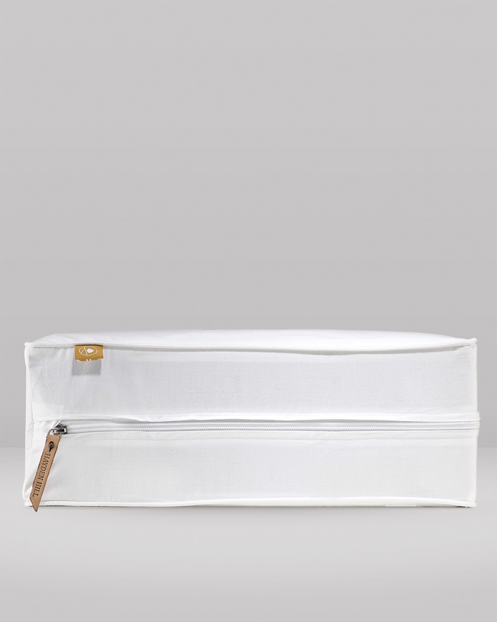 a side profile of a large storage bag showing the leather zipper pull and pip