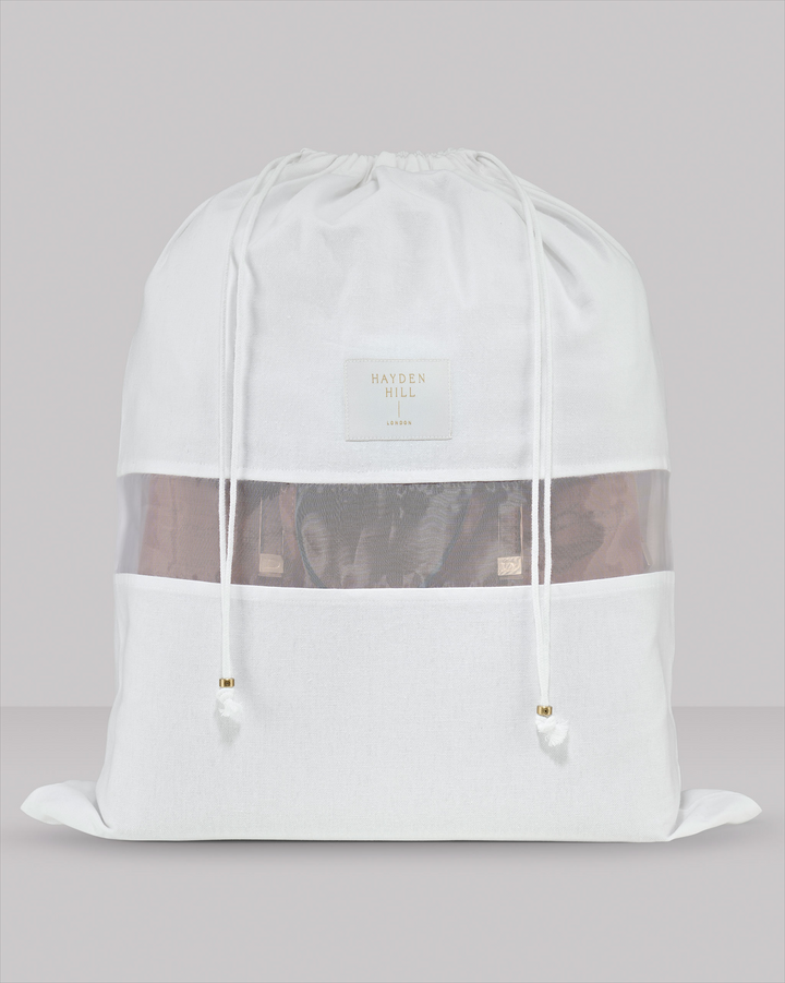 the front view of a large dust bag showing the organza panel and drawstrings with brass sliders