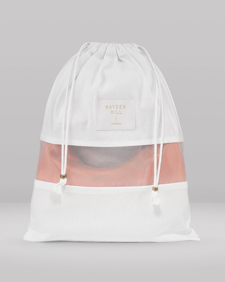 the front view of a small dust bag showing the organza panel and drawstrings with brass sliders