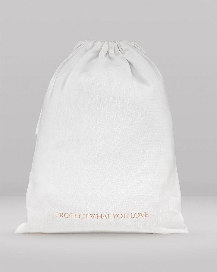 the rear view of a small dust bag showing the writing 'protect what you love'