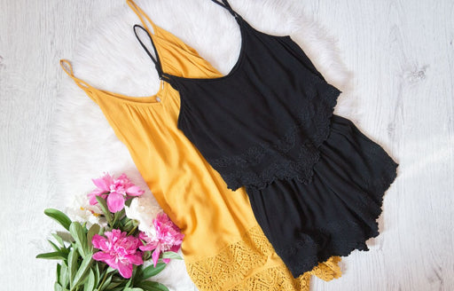 one black and one yellow lacy camisole